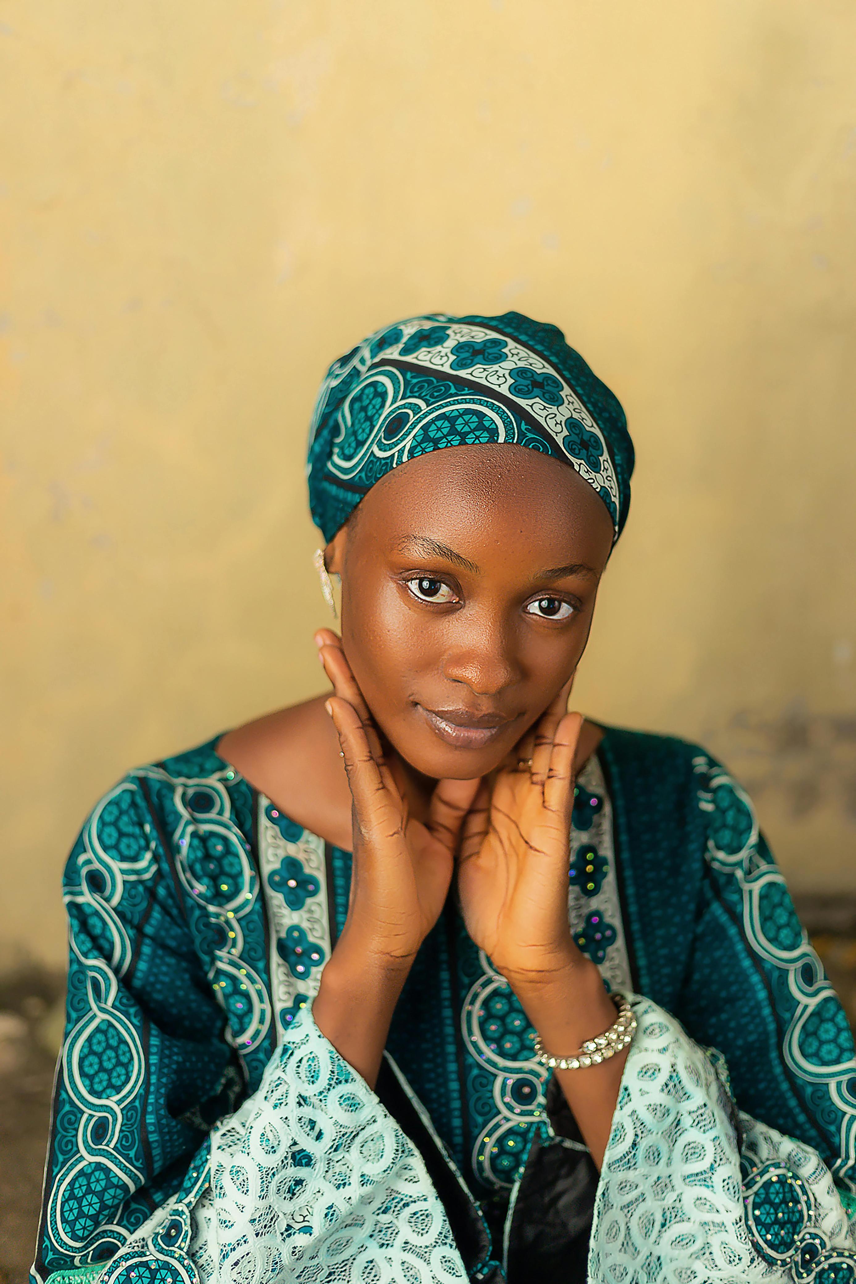A seller in a teal headwrap